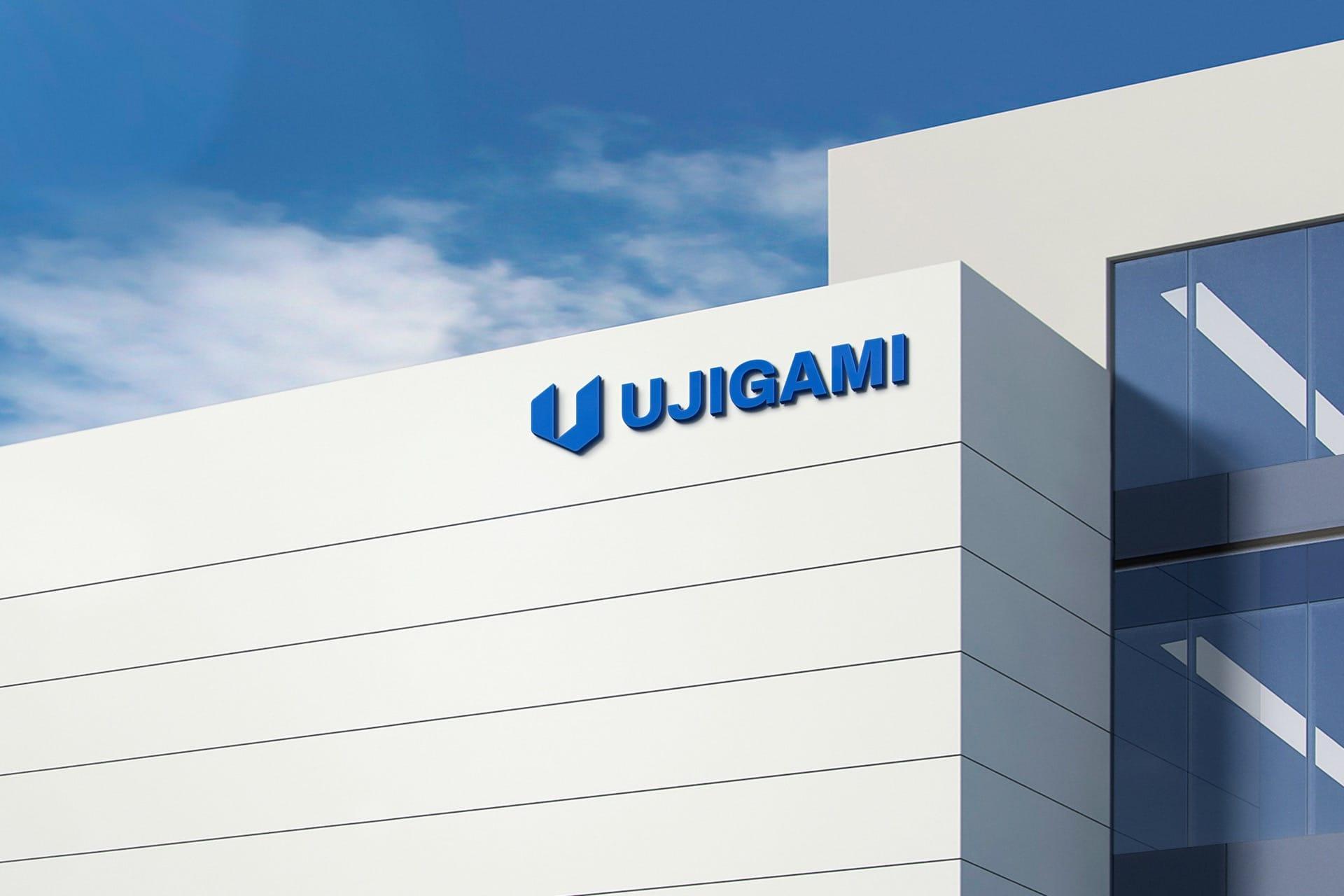 A large office with a Ujigami logo design on it